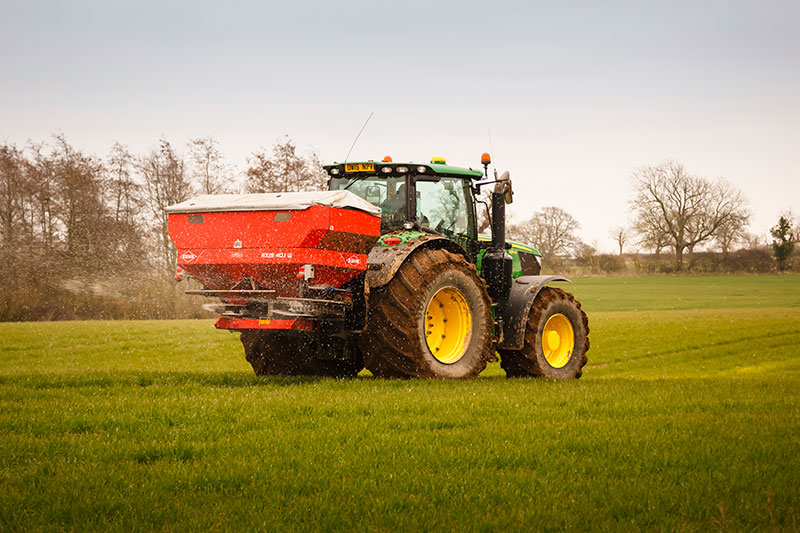 Tractor spraying crops